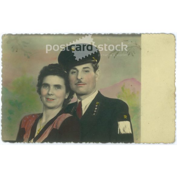 A miner with his wife, circa 1945. Colored photo sheet, postcard. (2791508)