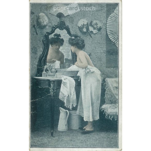 Young french woman getting ready in her boudoir. Colored photo sheet, postcard. (2791542)