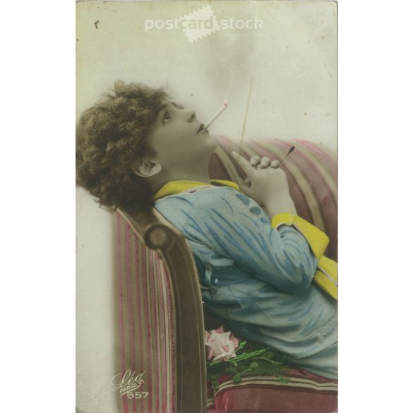 1925 – Young French woman with cigarette. Romantic postcard. Colored photo sheet. (2791563)