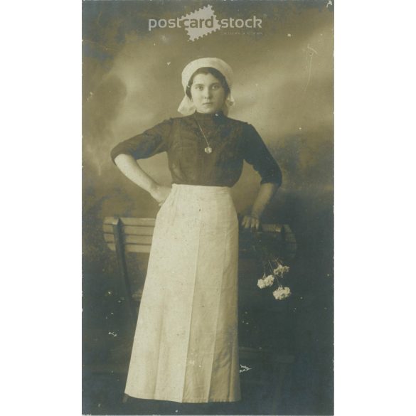 Middle class young woman with flowers. Studio shot, photo sheet. 1920s, 1930s. (2791798)