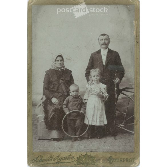 Photographic studio of Ágoston Schmidt, Budapest. Middle-class, full-family, studio photo of a family with two children. Cabinet photo / hardback photo / business card. (2791917)