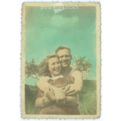   Young couple in sunny day. Original paper image. Colored photo. 1940s. (2791938)