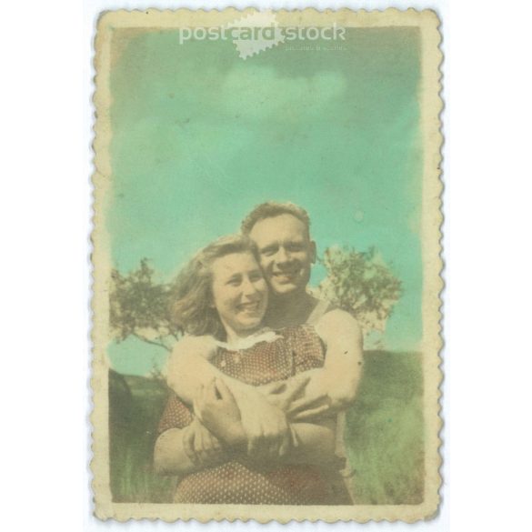 Young couple in sunny day. Original paper image. Colored photo. 1940s. (2791938)