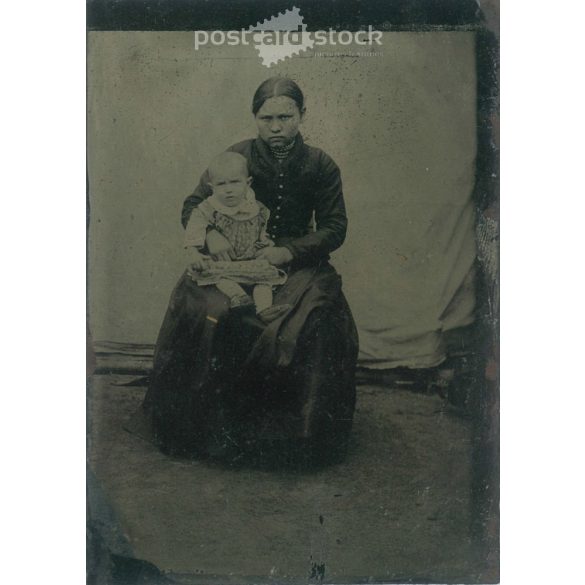 Young woman with her baby in elegant attire both of them. Original ferrotype. (2792025)