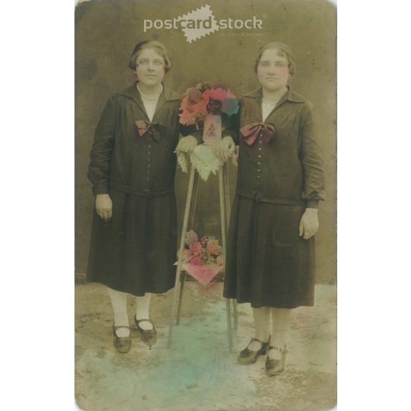 1Full-length studio photo of a pair of twins. Original paper image. Colored photo sheet, postcard. 1910s. (2792042)