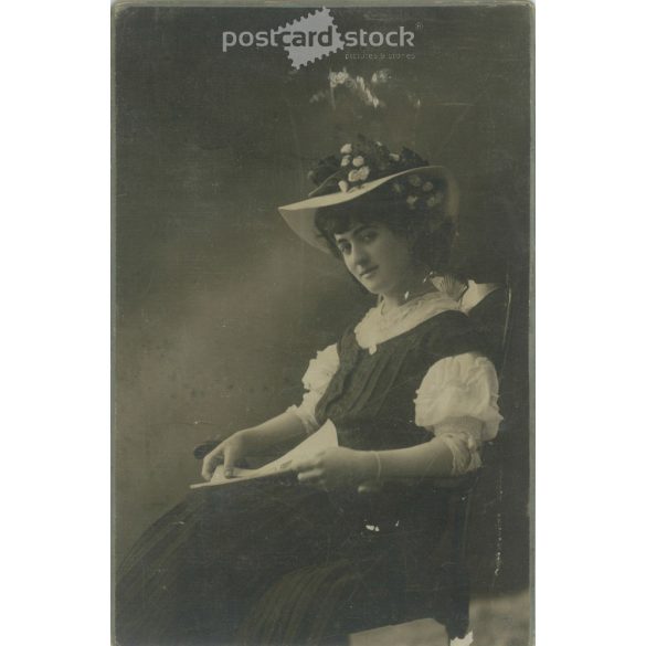 Early 1900s. Budapest photography studio. Full-length studio photo. Young woman in elegant dress and hat decorated with flowers. Cabinet photo / hardback photo / business card, CDV photo. (2792117)