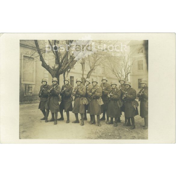 1930s. The picture shows a platoon of German soldiers with guns. Black and white photo sheet, postcard. (2792156)