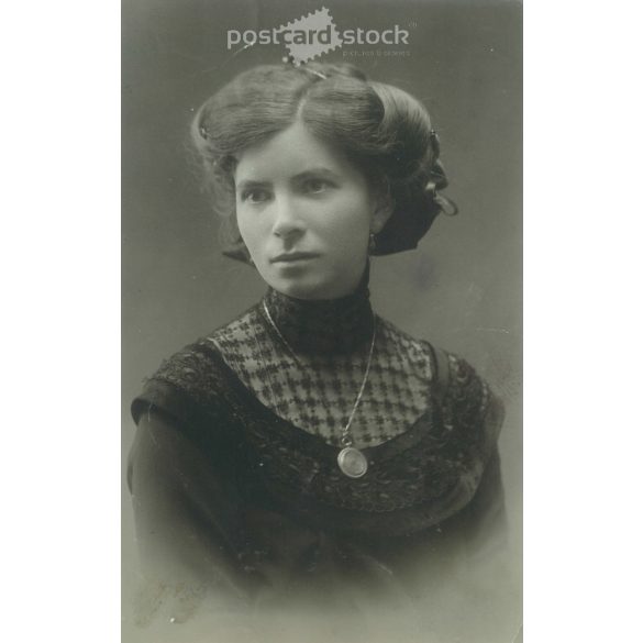 1920s. Photo of an elegant, young woman with fashionable hairstyles and neckties of the time. Original paper image. (2792159)