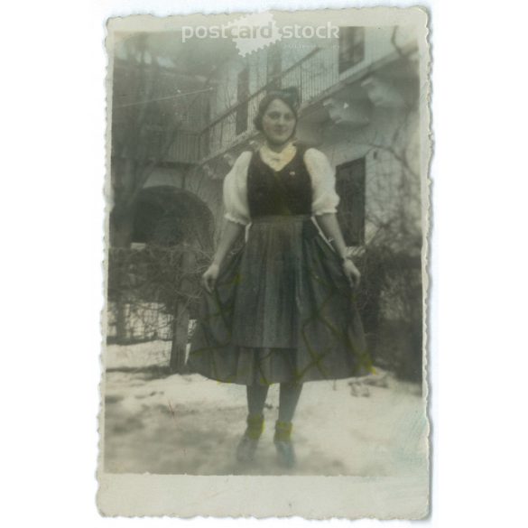 1930s. Unknown young girl in the courtyard. Winter shot. Original paper image. Its maker is unknown. (2792224)