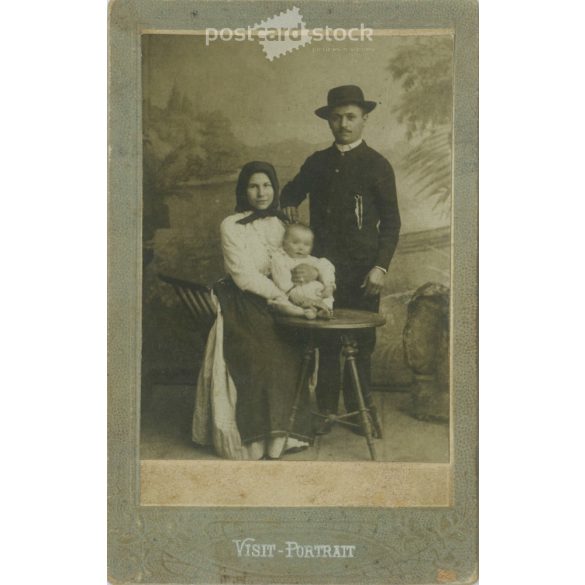 1910s. Studio portrait of a married couple with their child, full-length. Made in the Papír Speed Photography studio, Városloget, Budapest. Original cabinet photo / hardback photo / business card, CDV photo. (2792269)