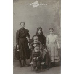   Early 1900s. Mother with children, studio shot. Its maker is unknown. Photo sheet, postcard. Original paper image. (2792279)