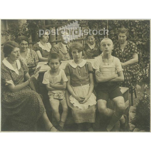 1910s. Family playing cards in the garden. The creator of the image and the identity of the people in the image are unknown. The photo was taken in Hungary. Original paper image. (2792292)