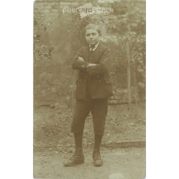 1920s. Photo of an unknown boy in the garden. The creator of the picture and the boy in the picture are unknown. Photo sheet, postcard. (2792301)