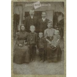   Early 1900s. Family group photo in the yard. The persons in the picture are unknown. It was taken in the photo studio of Illés Wucsetics in Budapest. Covered on hardboard. Cabinet photo / hardback photo / business card. (2792314)