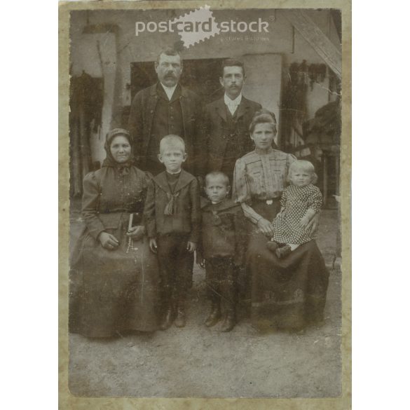 Early 1900s. Family group photo in the yard. The persons in the picture are unknown. It was taken in the photo studio of Illés Wucsetics in Budapest. Covered on hardboard. Cabinet photo / hardback photo / business card. (2792314)