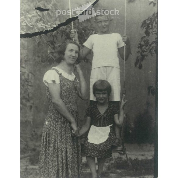 1932 – Photo with the garden swing. Black and white original paper image, old photo. (2792401)