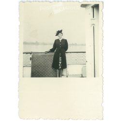   1930s. Young woman in a hat on a boat. Black and white original paper image, old photo. (2792403)