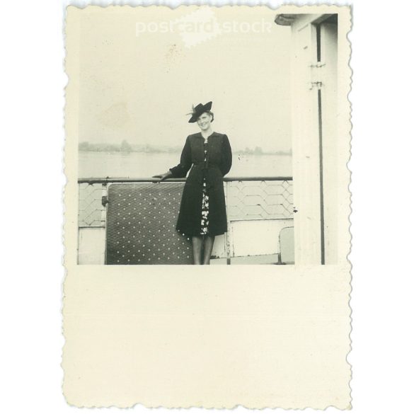 1930s. Young woman in a hat on a boat. Black and white original paper image, old photo. (2792403)