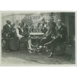   1930s. Cheerful, wine-drinking people. Black and white original paper image, old photo. (2792405)