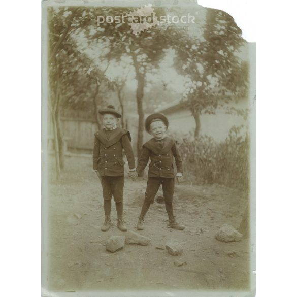 Early 1900s. A pair of brothers, wearing the same outfit. Black and white original paper image, old photo. The creator of the image is unknown. (2792410)