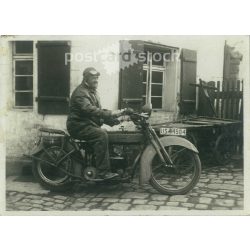   1930s. Germany. Man on motorbike before departure. The creator of the image is unknown. Black and white original paper image, old photo. (2792433)