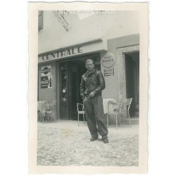   1964 – Young man in front of a cafe. Made by FOKI Foto photography studio. Black and white original paper image, old photo. (2792453)