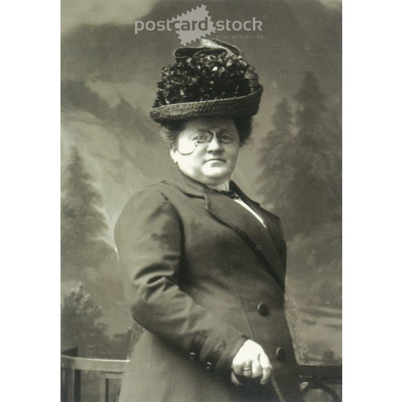 1960s. Germany. Elegant lady in hat with zwicker. Cut out postcard. Black and white reprint from an old photo. (2792458)