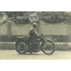   1920s. Germany. Motorcycle man on the street. Black and white original paper image, old photo. (2792470)