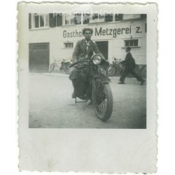   1920s. Germany. Young man on a stationary motorbike. The picture was taken by Müller sche apotheke. Black and white original paper image, old photo. (2792475)