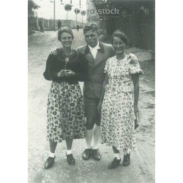 1950s. Germany. A young man in the company of ladies. The picture was taken by Foto-Seitz. Black and white original paper image, old photo. (2792491)