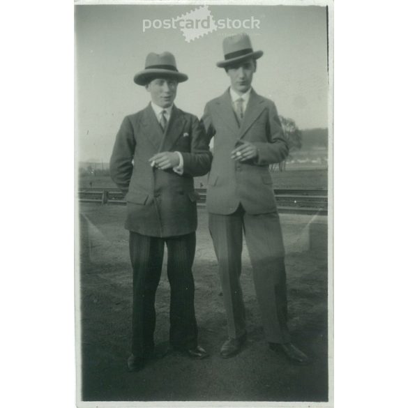 1950s. Germany. Young people with cigarettes. The creator of the picture and the identity of the people on it are unknown. Black and white original paper image, old photo. (2792492)