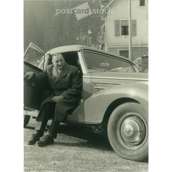 1950s. Germany. With a Mercedes sports coupe. The creator of the picture and the person on it are unknown. Black and white original paper image, old photo. (2792496)