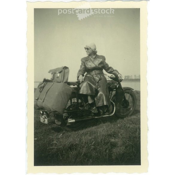 1952. Germany. Young lady with motorbike. The creator of the picture and the person on it are unknown. Black and white original paper image, old photo. (2792506)