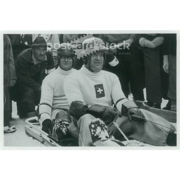 1936. Germany. The Swiss bobsleigh team at the Berlin Olympics. Black and white, reprint after an old photo, Olympic card. (2792523)