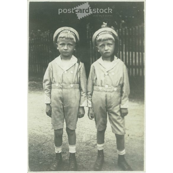 1922. Germany. Sad twins. The creator of the picture and the identity of the people on it are unknown. Black and white original paper image, old photo. (2792529)