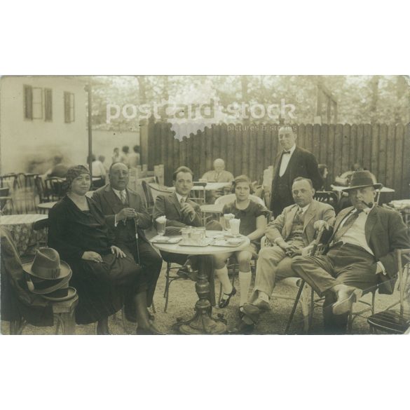 1910s. With family on the terrace of a restaurant. Original paper image. Black and white old photo sheet, postcard. Its maker is unknown. (2792540)