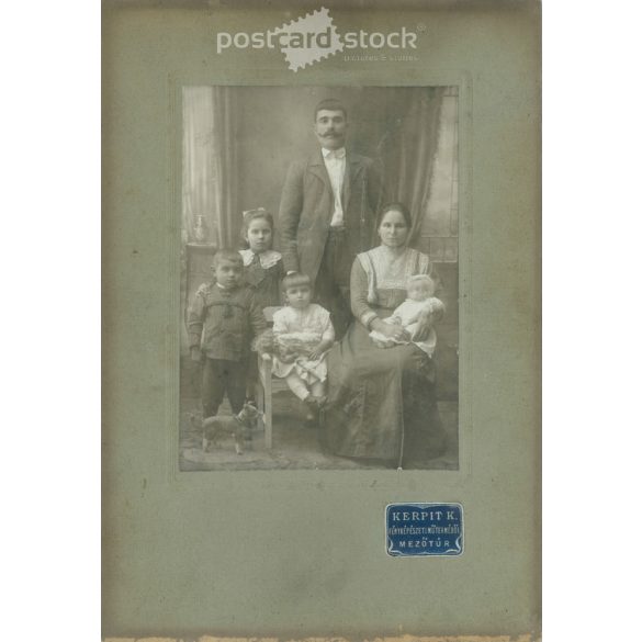 Early 1900s. A full-length studio shot of a married couple and their five children. Made by K. Kerpit’s photography studio, Mezőtúr. Old photo, original cabinet photo / hardback photo. (2792556)