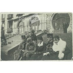   1920s. Hungary. Soldiers in the company of ladies. The creator of the picture and the identity of the people on it are unknown. Black and white original paper image, old photo. (2792665)