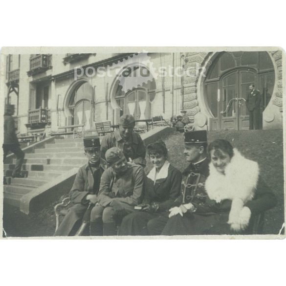 1920s. Hungary. Soldiers in the company of ladies. The creator of the picture and the identity of the people on it are unknown. Black and white original paper image, old photo. (2792665)