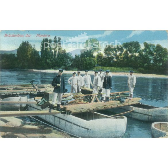 1915 – Bridge construction by pioneers. Photo on paper, reproduction of a colored photo, old postcard, print. (2792669)