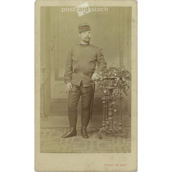 Late 1870s. Full-length studio photo of a soldier. The person in the picture is unknown. Original paper image. The photo was taken in the photography studio of Gondy and Egey. in Debrecen. Old photo, business card, CDV photo. (2792676)