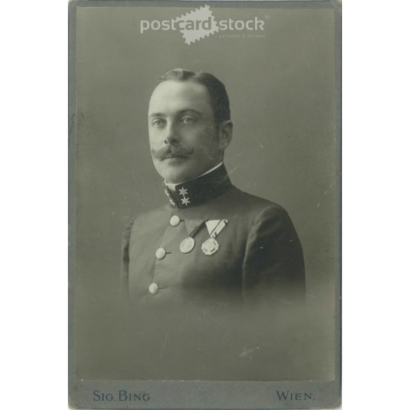 Early 1900s. Studio photo of a soldier with decorations. The person in the picture is unknown. The work of the Sig Bing photography studio. Vienna. Old photo, original cabinet photo / hardback photo. (2792723)