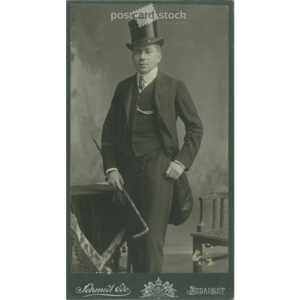 Early 1900s. Studio photo of an elegant man, in a top hat, with a walking stick, full-length. The work of Schmidt Ede photography studio. Budapest. Old photo, original cabinet photo / hardback photo. (2792726)