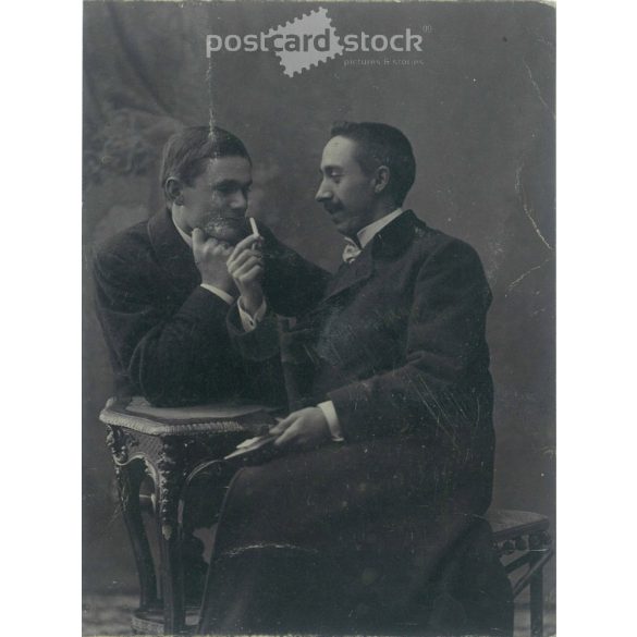 Around 1900. Studio shot of elegant young men. The identity of the people in the picture and the creator of the picture are unknown. Original paper image. Old photo. Black and white photo sheet, old postcard, cut. (27925785)